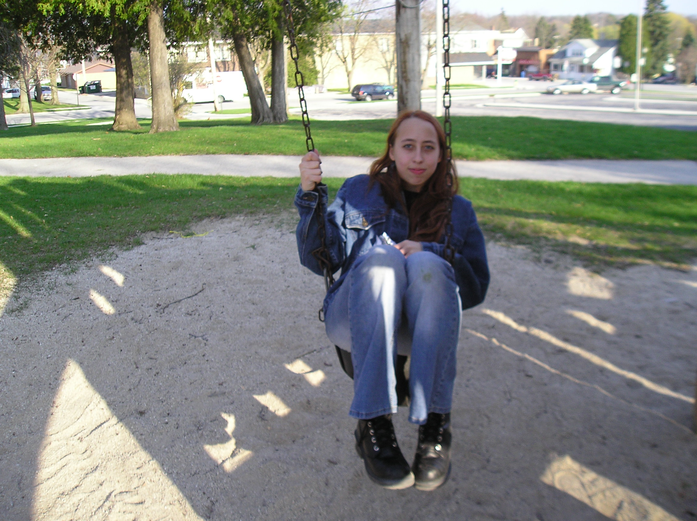 McBeth sitting on a swing.